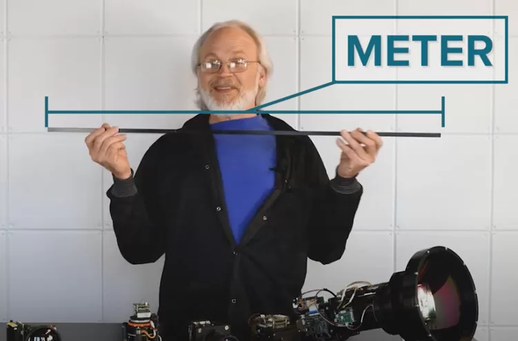 Stan holding up a 1 meter piece of metal